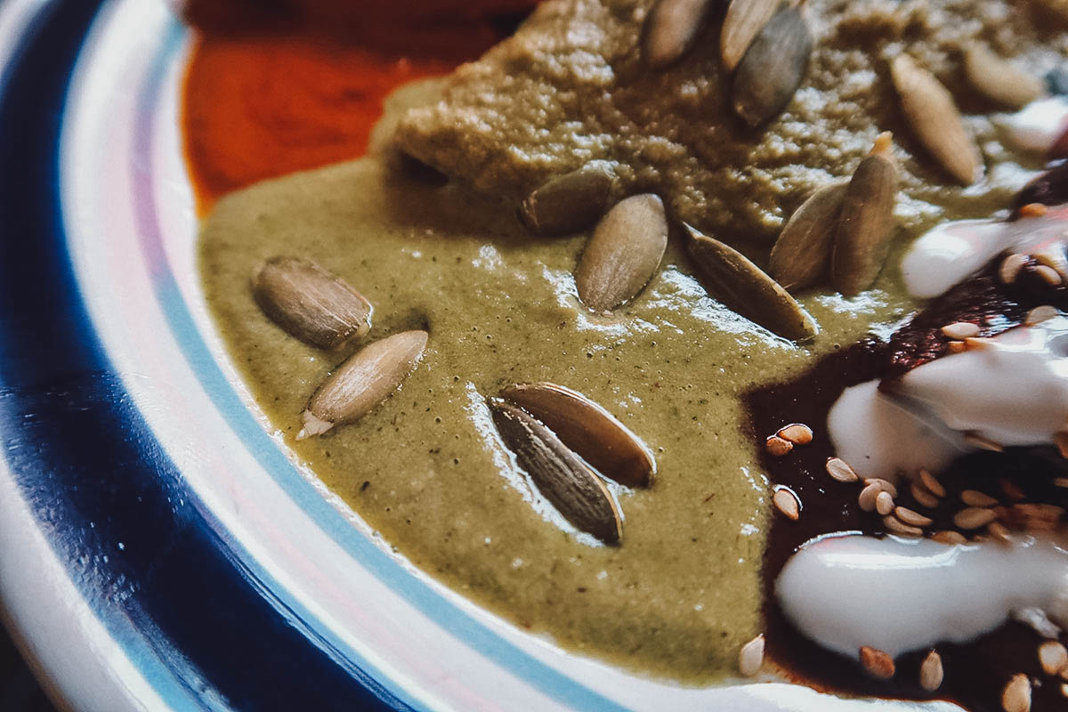 The Best Pipian in Puebla Pipian verde garnished with whole pumpkin seed in Puebla